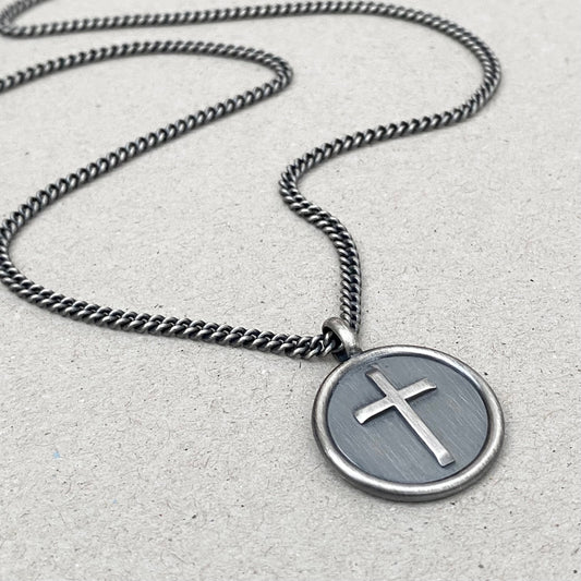 Oxidised solid silver framed circle cross pendant on a curb chain