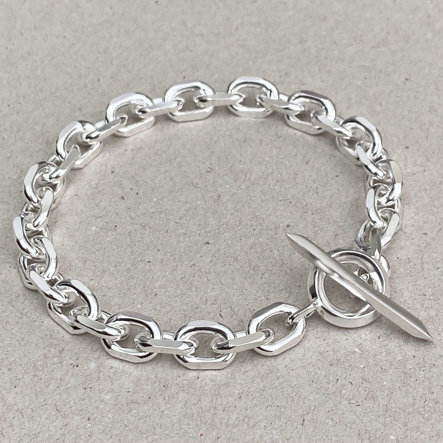Oxidised or polished solid silver 8.5mm wide diamond cut trace chain bracelet with a unique T-bar design