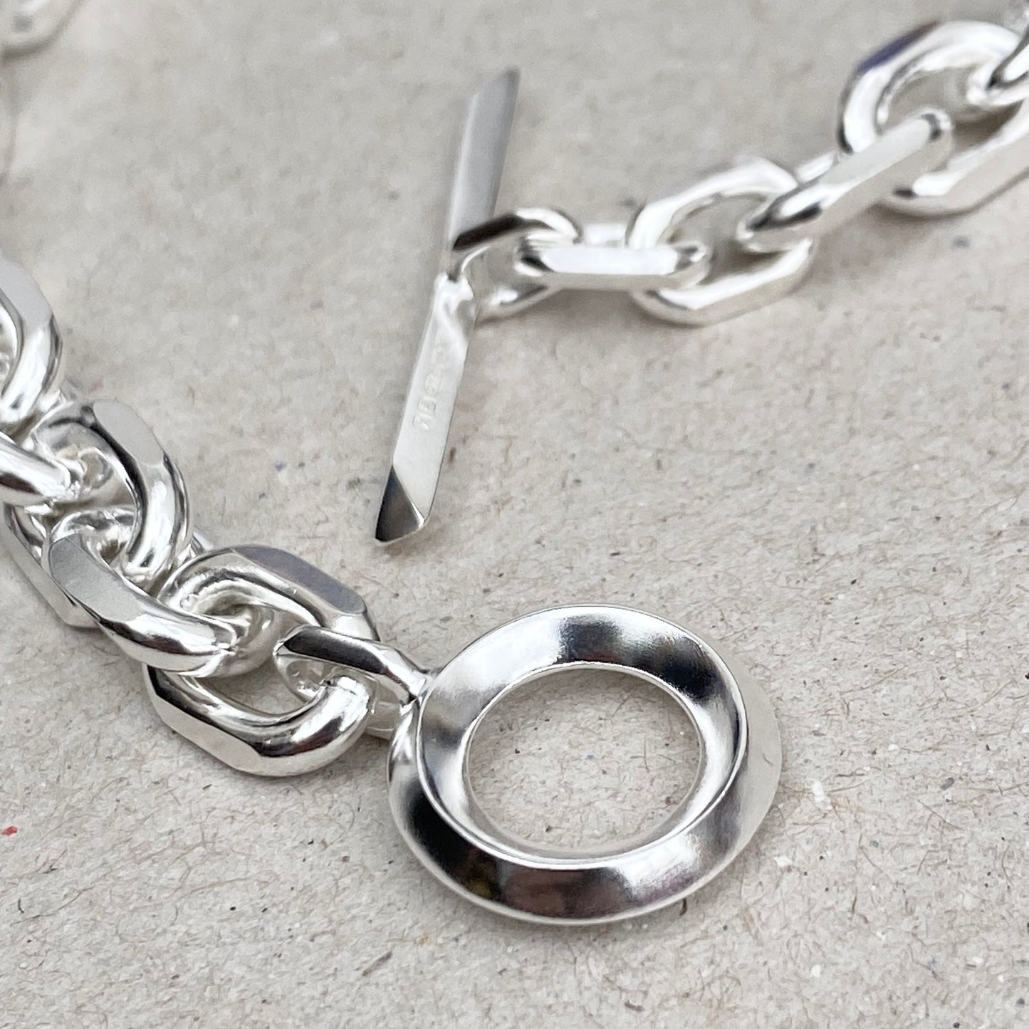 Oxidised or polished solid silver 8.5mm wide diamond cut trace chain bracelet with a unique T-bar design