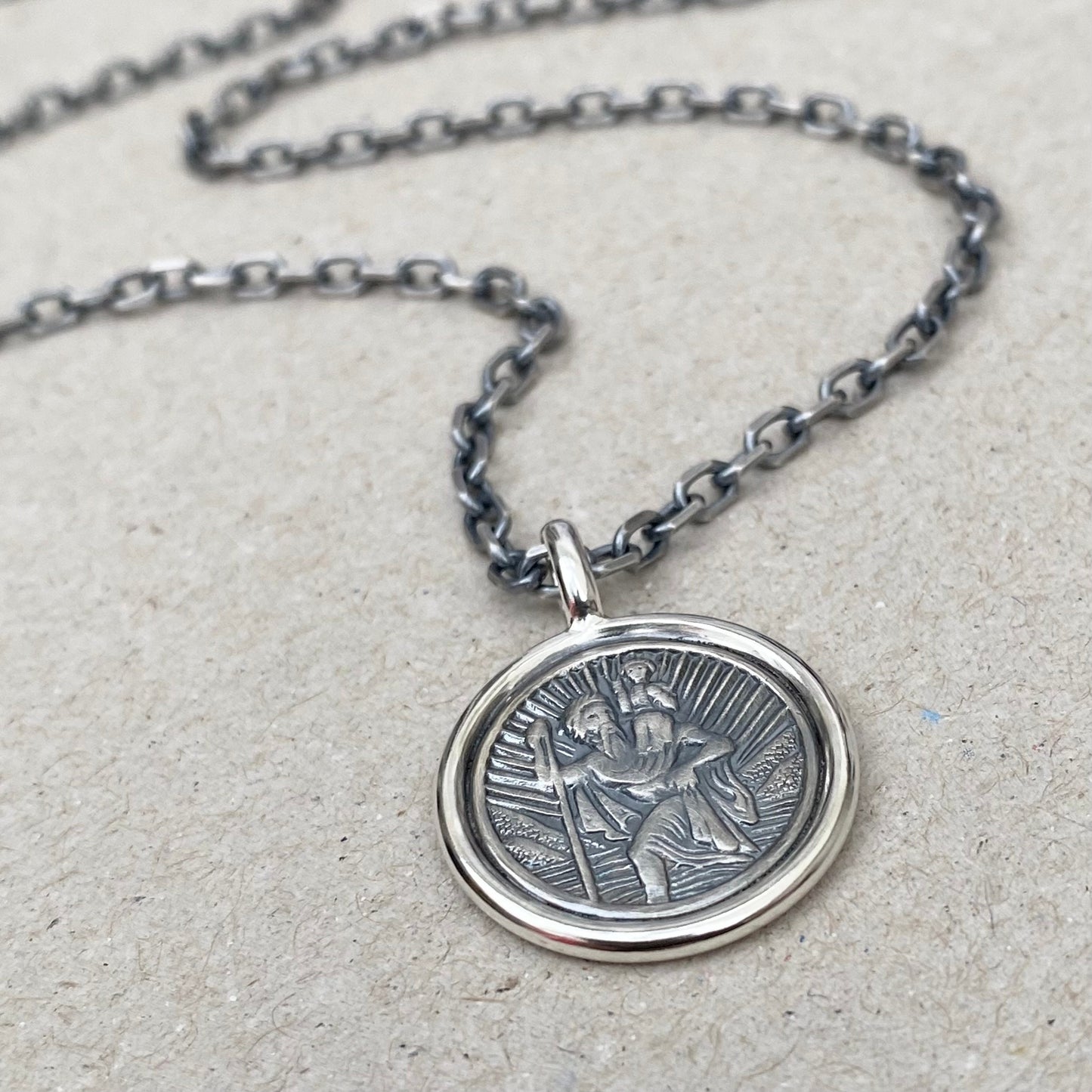 Oxidised solid silver Saint Christopher circle framed pendant on a 3mm wide diamond cut trace chain