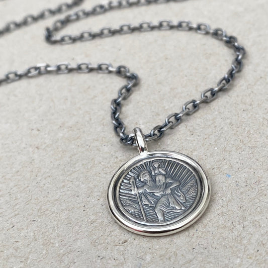 Oxidised solid silver Saint Christopher circle framed pendant on a 3mm wide diamond cut trace chain