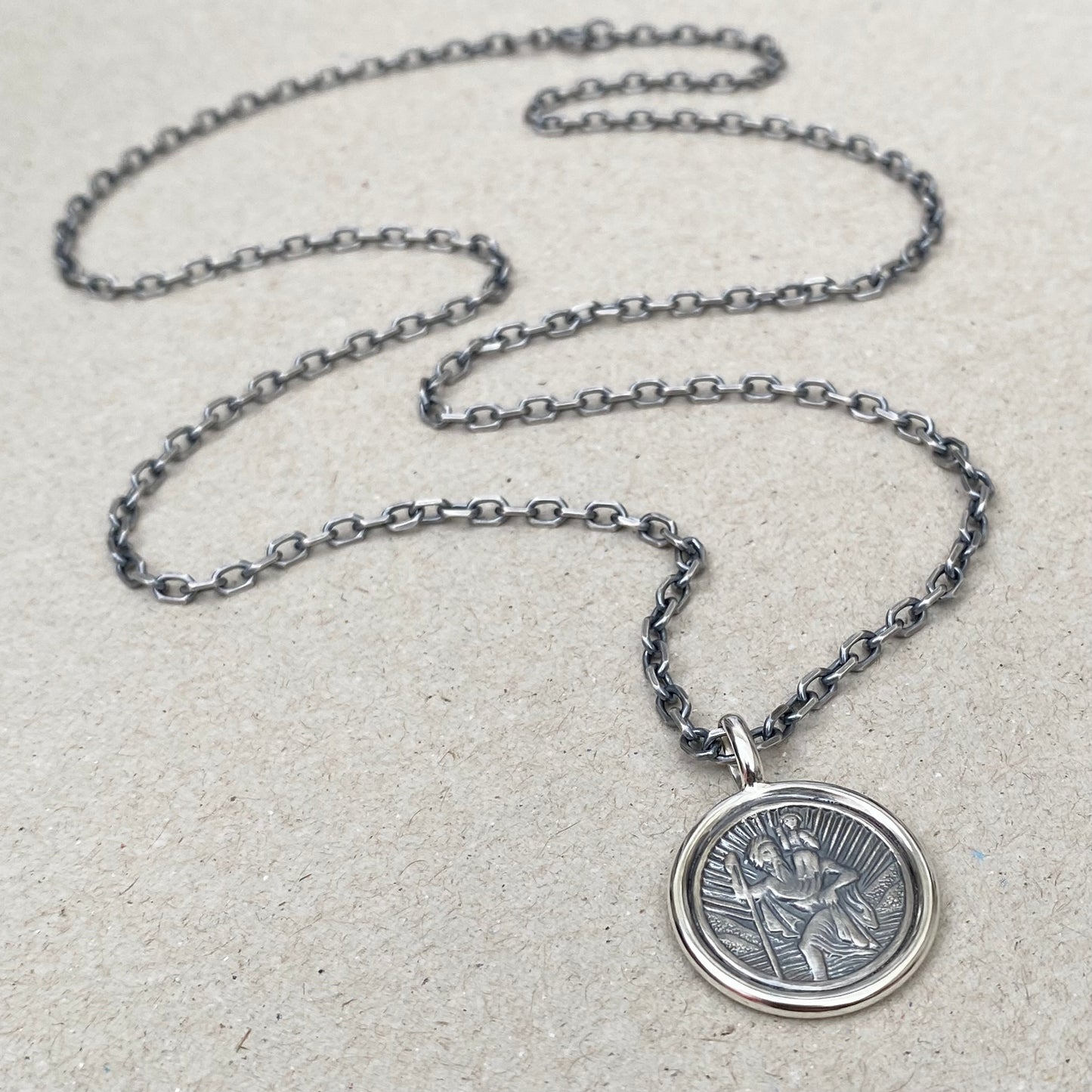 Oxidised solid silver Saint Christopher circle framed pendant on a 3mm wide diamond cut trace chain