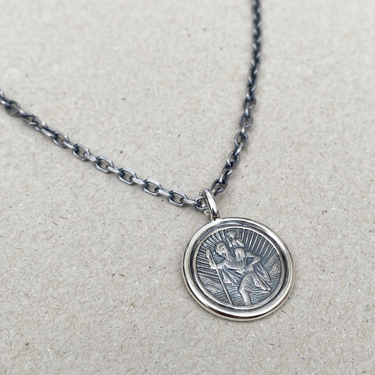 Oxidised solid silver Saint Christopher circle framed pendant on a 3mm wide diamond cut trace chain
