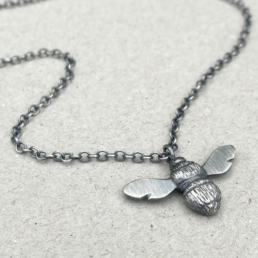 Oxidised solid silver garden bumblebee pendant on a 2.2mm wide trace chain