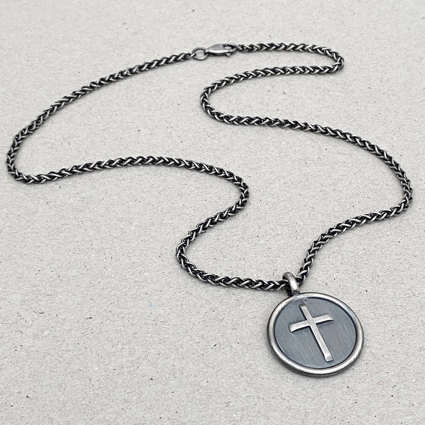 Oxidised solid sterling silver framed circle cross pendant on a spiga chain