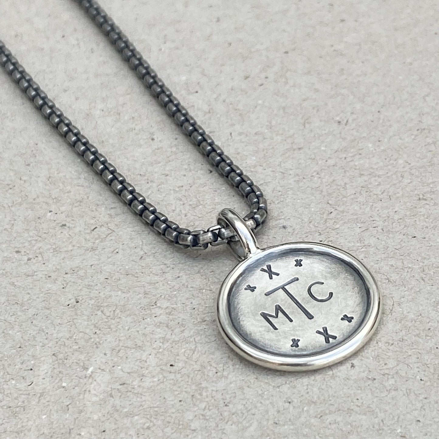 Handmade oxidised solid sterling silver round framed initial pendant on a round box belcher chain