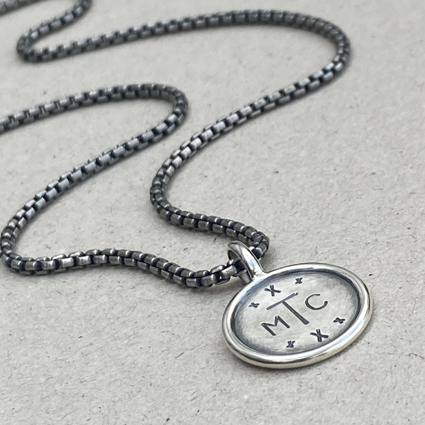 Handmade oxidised solid sterling silver round framed initial pendant on a round box belcher chain