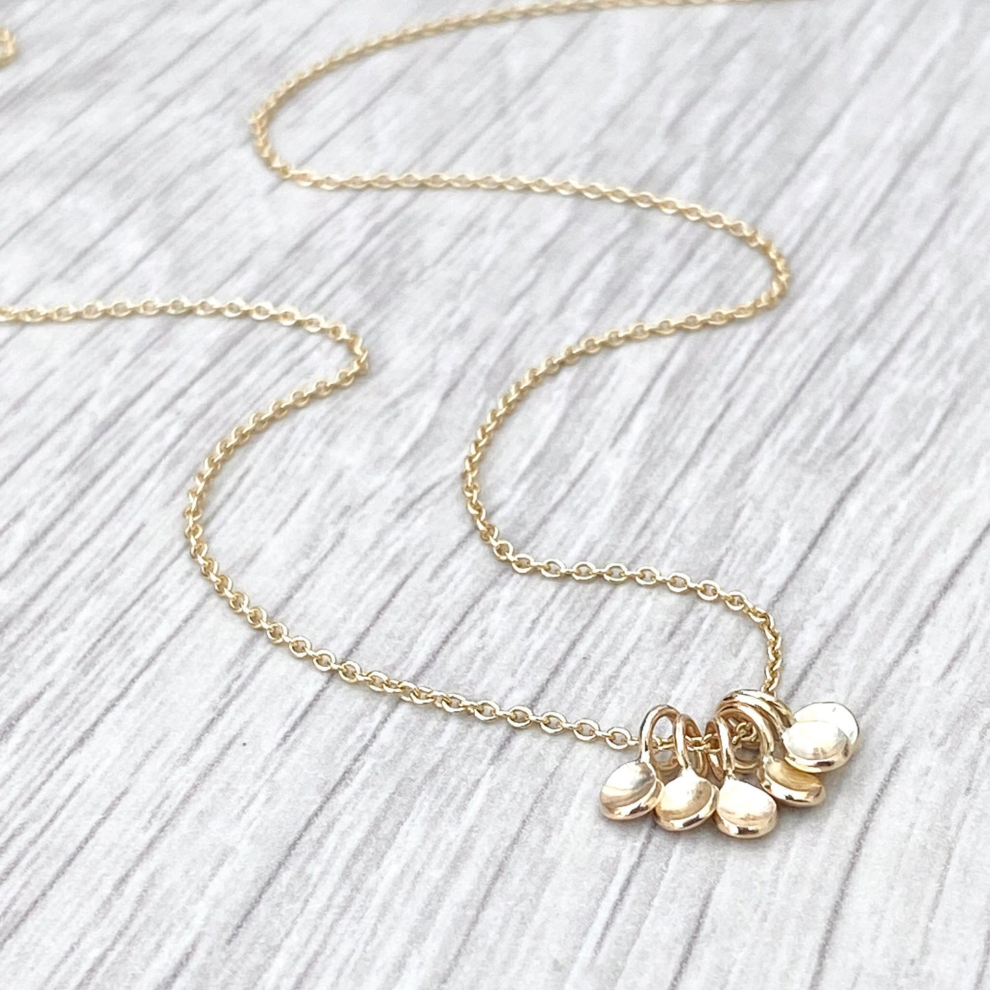 Handmade 9ct yellow gold six tiny petal charm pendants on a trace chain