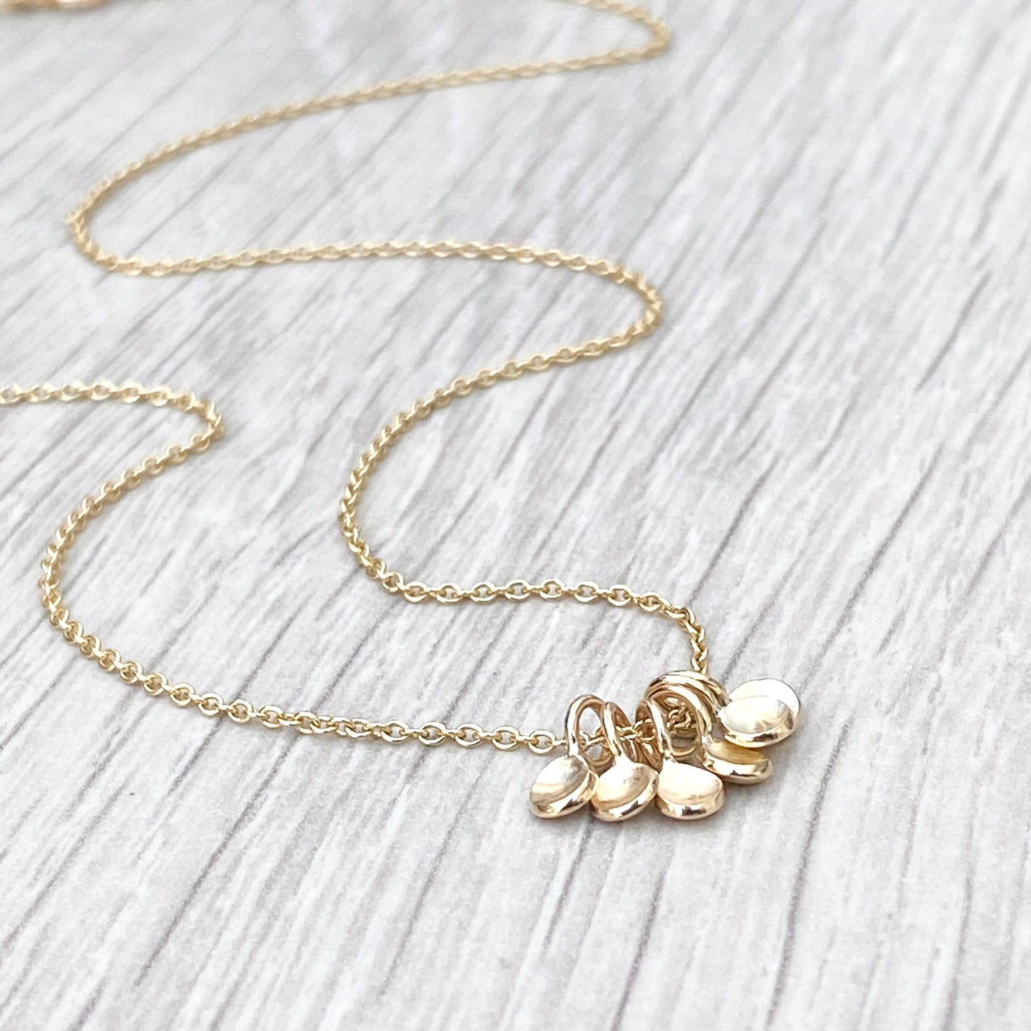Handmade 9ct yellow gold six tiny petal charm pendants on a trace chain