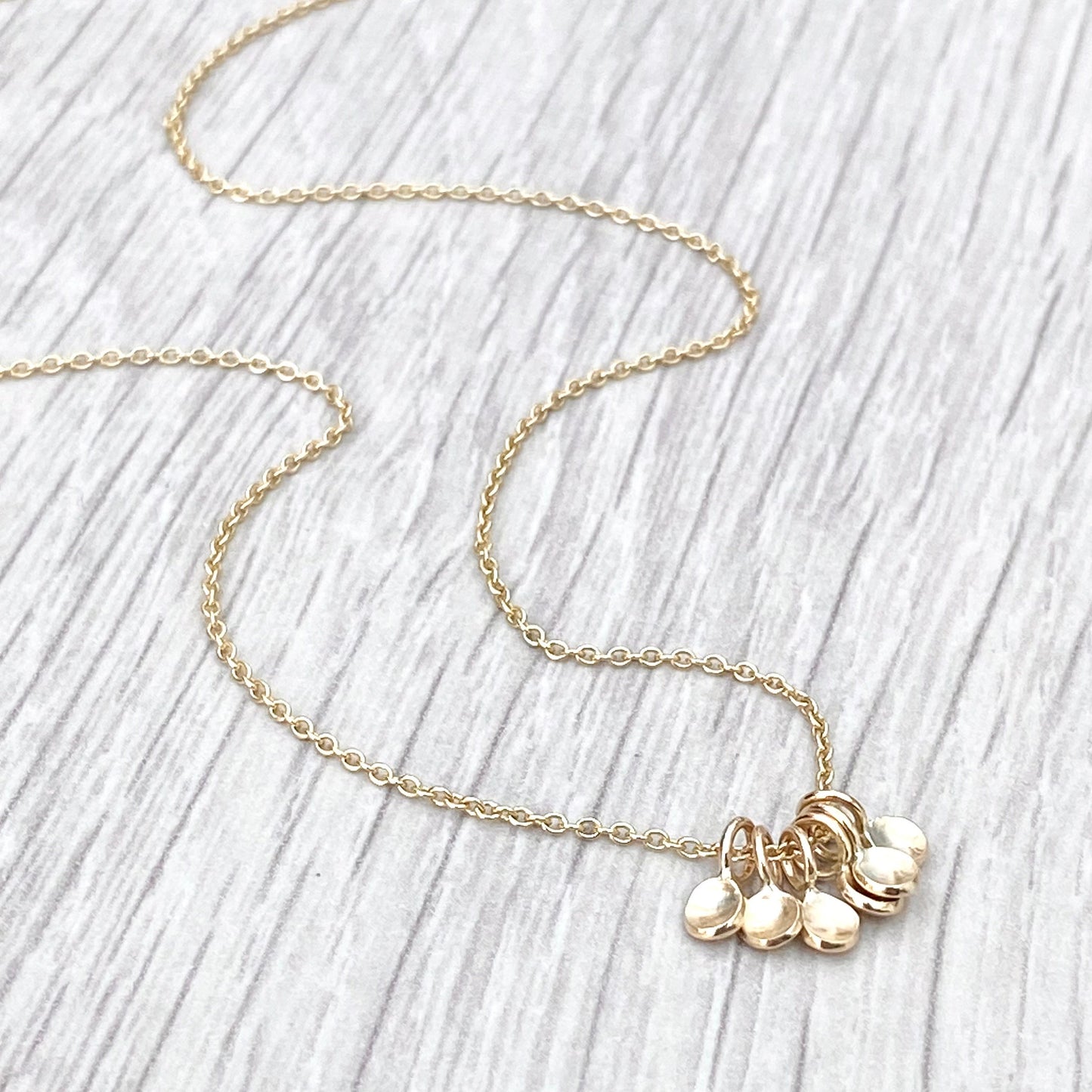 Handmade 9ct yellow gold six tiny petal charm pendants on a trace chain