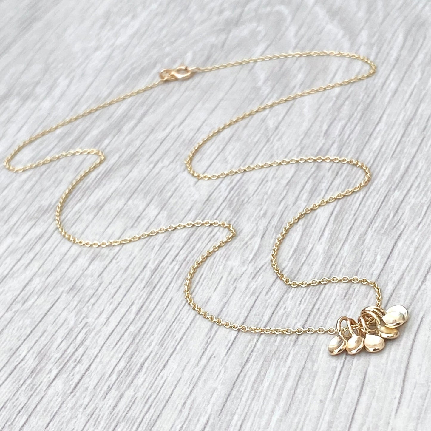 Handmade 9ct yellow gold six tiny petal charm pendants on a trace chain