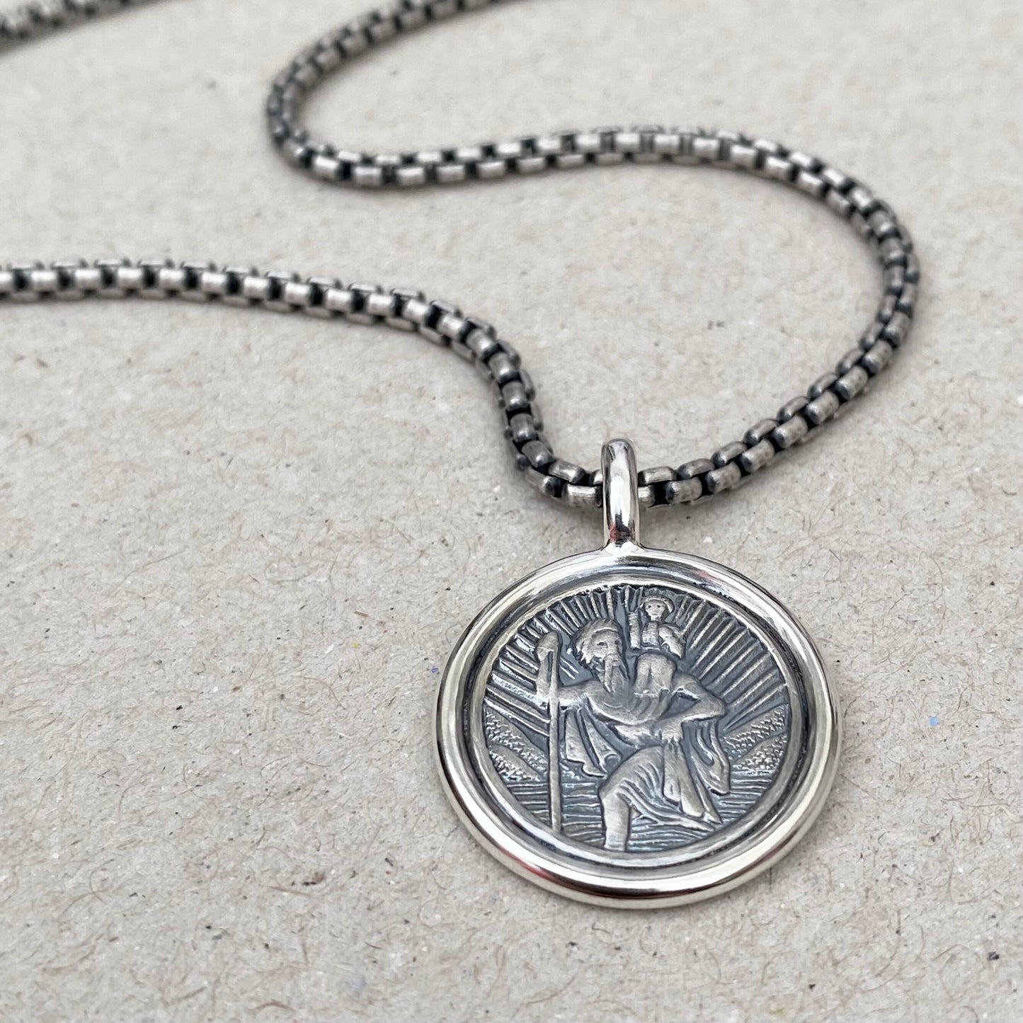 Oxidised solid silver Saint Christopher framed circle pendant on a 2.5mm wide round box belcher chain