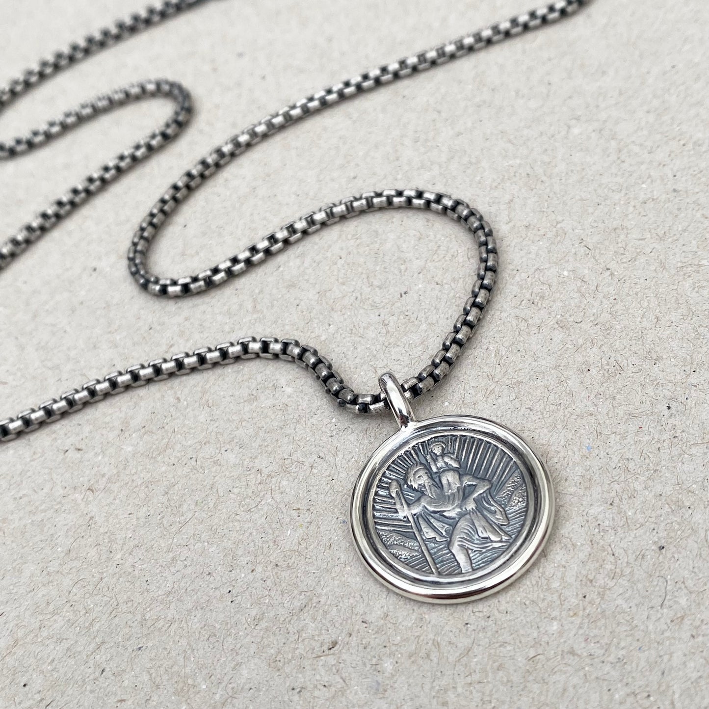 Oxidised solid silver Saint Christopher framed circle pendant on a 2.5mm wide round box belcher chain