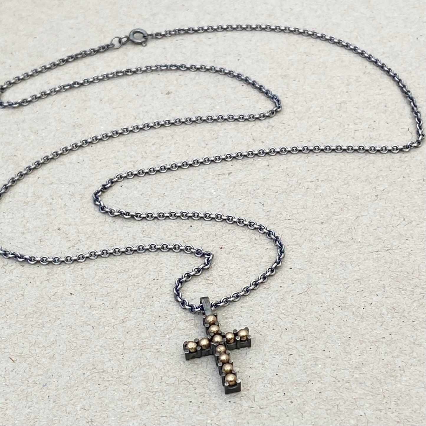 Oxidised sterling silver and 9ct yellow gold ball detail cross pendant on a 1.9mm close trace chain
