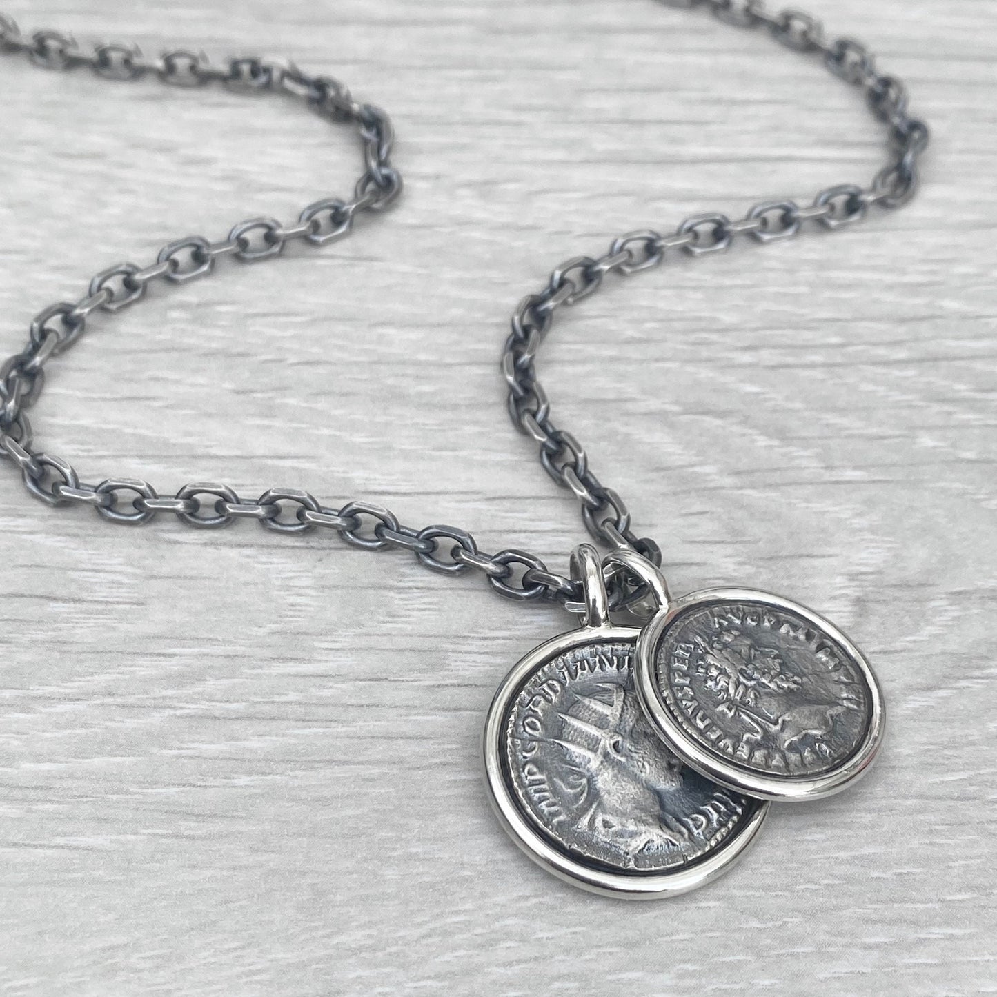 Oxidised solid Sterling silver replica Roman coin circle framed pendants on a choice of trace or round box chain
