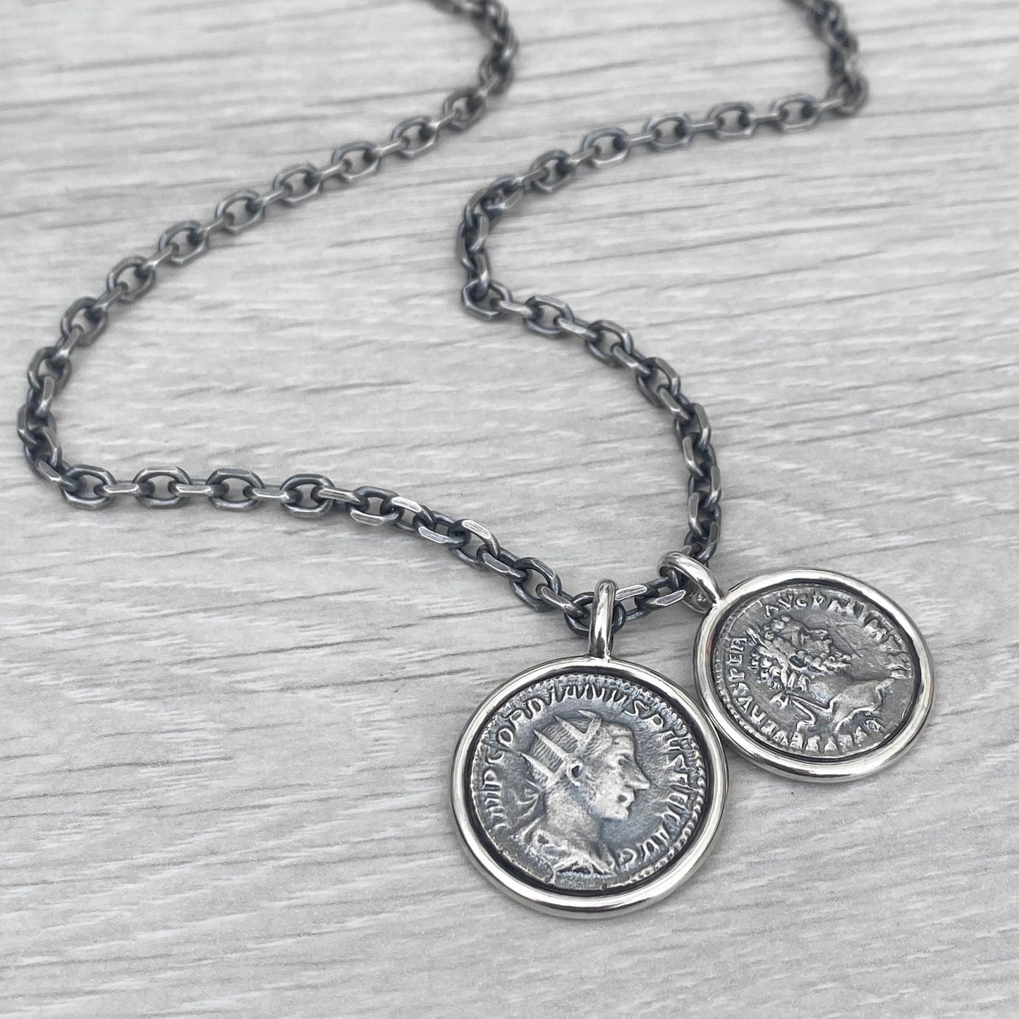 Oxidised solid Sterling silver replica Roman coin circle framed pendants on a choice of trace or round box chain