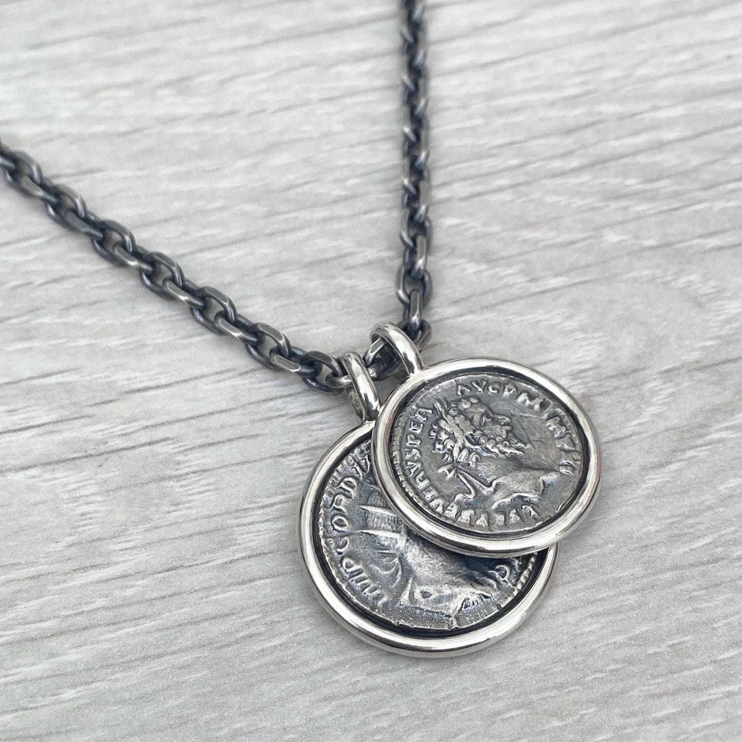 Oxidised solid Sterling silver replica Roman coin circle framed pendants on a choice of trace or round box chain