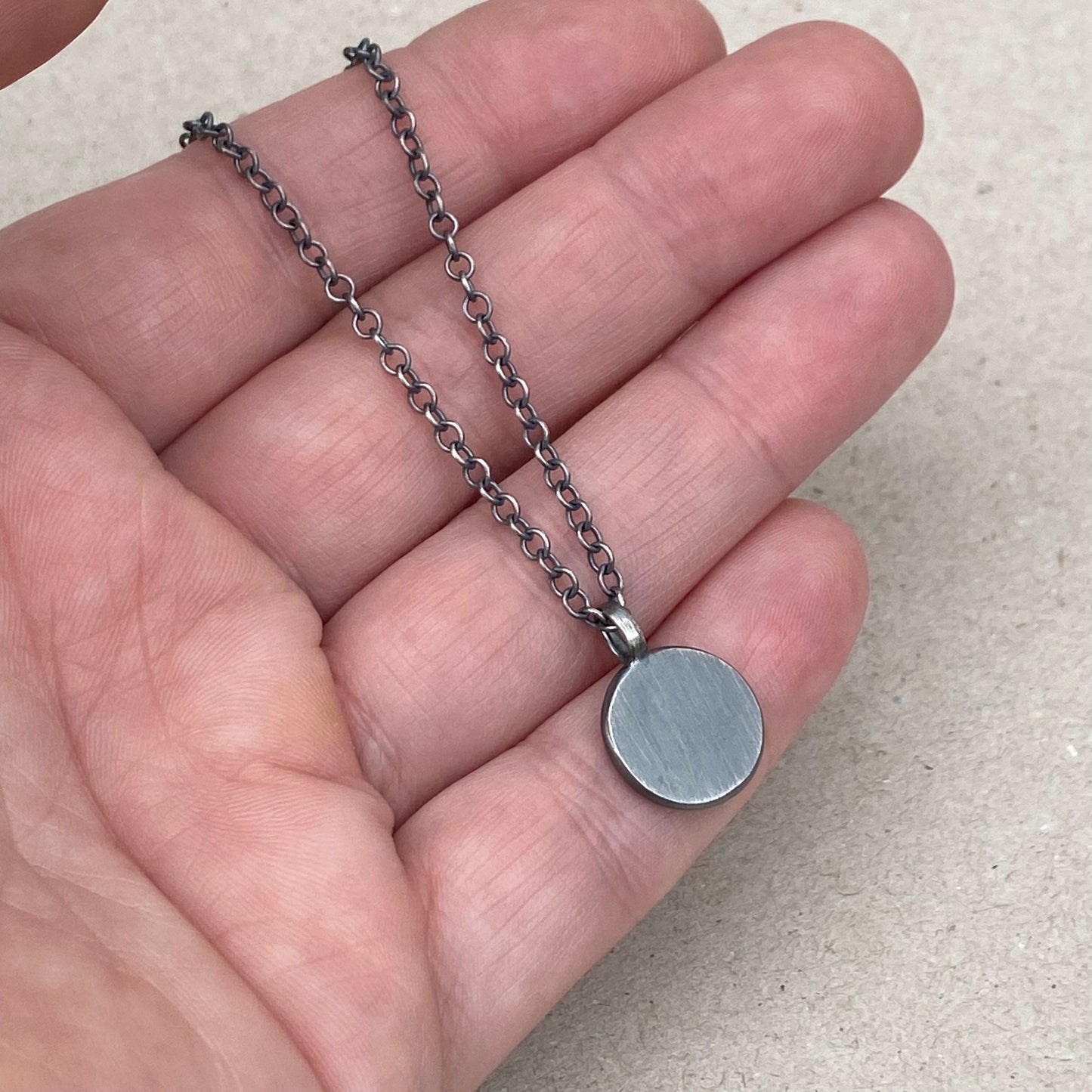 Oxidised silver star engraved birthstone 13mm pendant on a trace chain