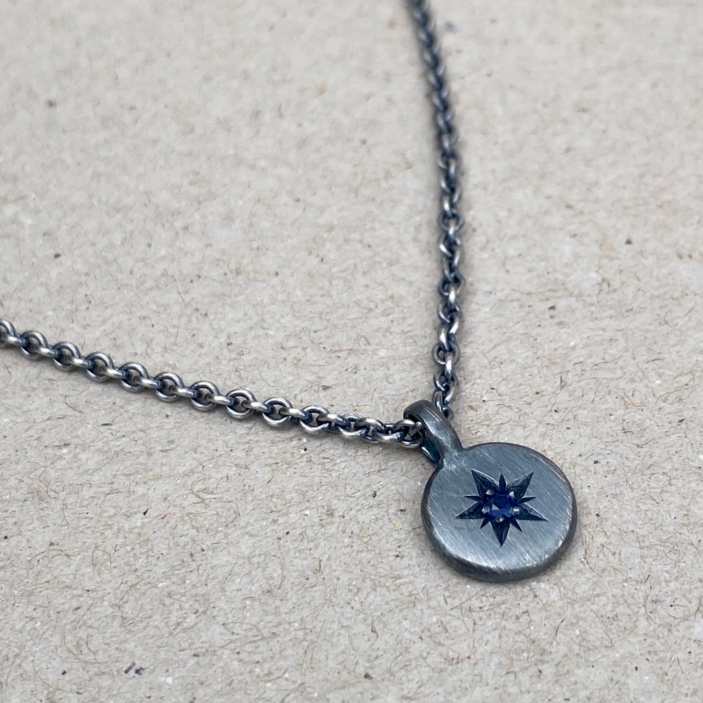 Oxidised silver star engraved birthstone 10mm pendant on a tight trace chain