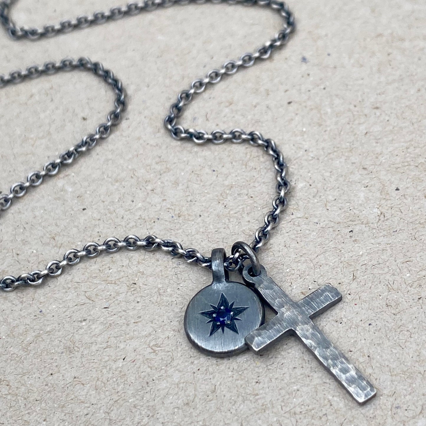 Oxidised silver star engraved birthstone 10mm pendant and hammered cross on tight trace chain