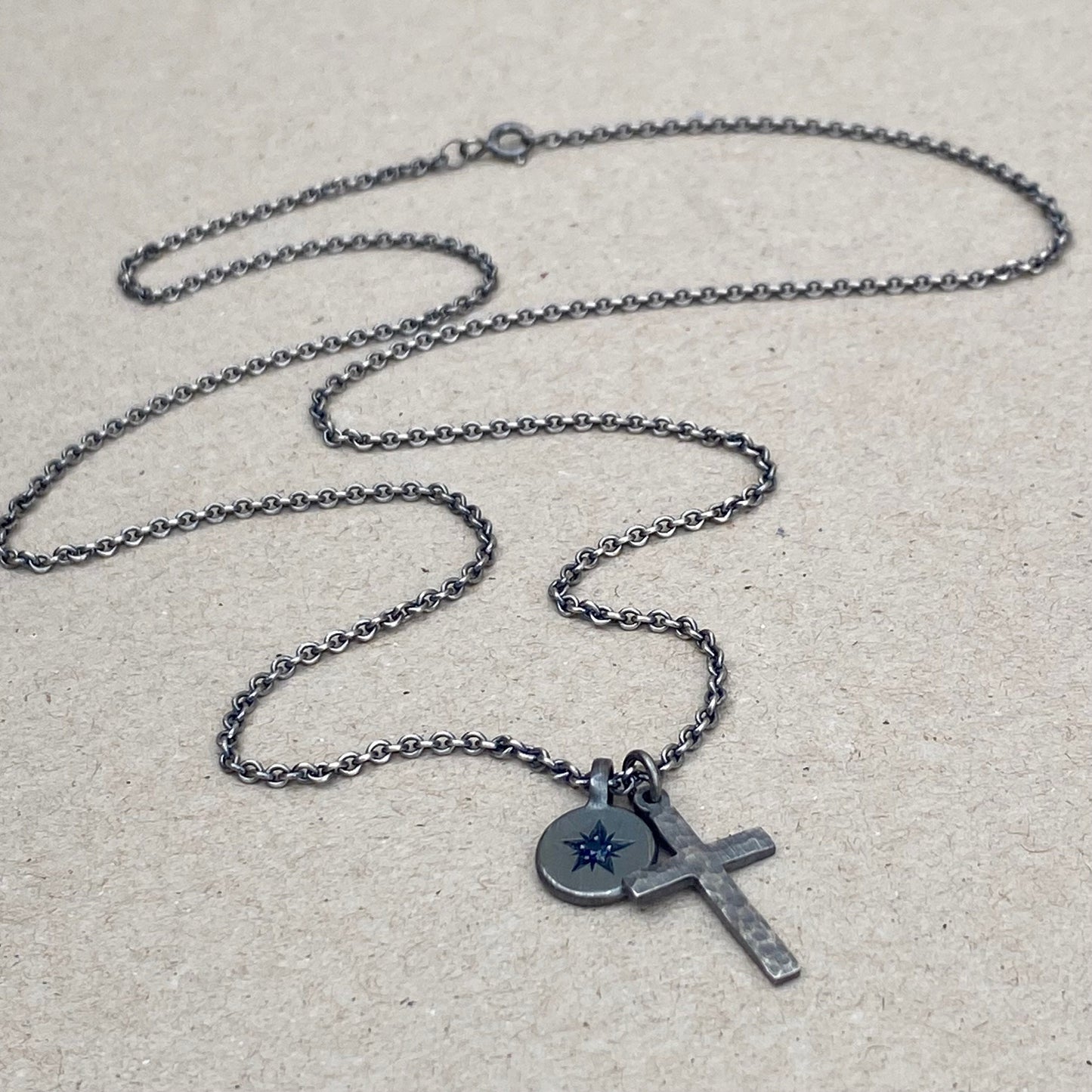 Oxidised silver star engraved birthstone 10mm pendant and hammered cross on tight trace chain