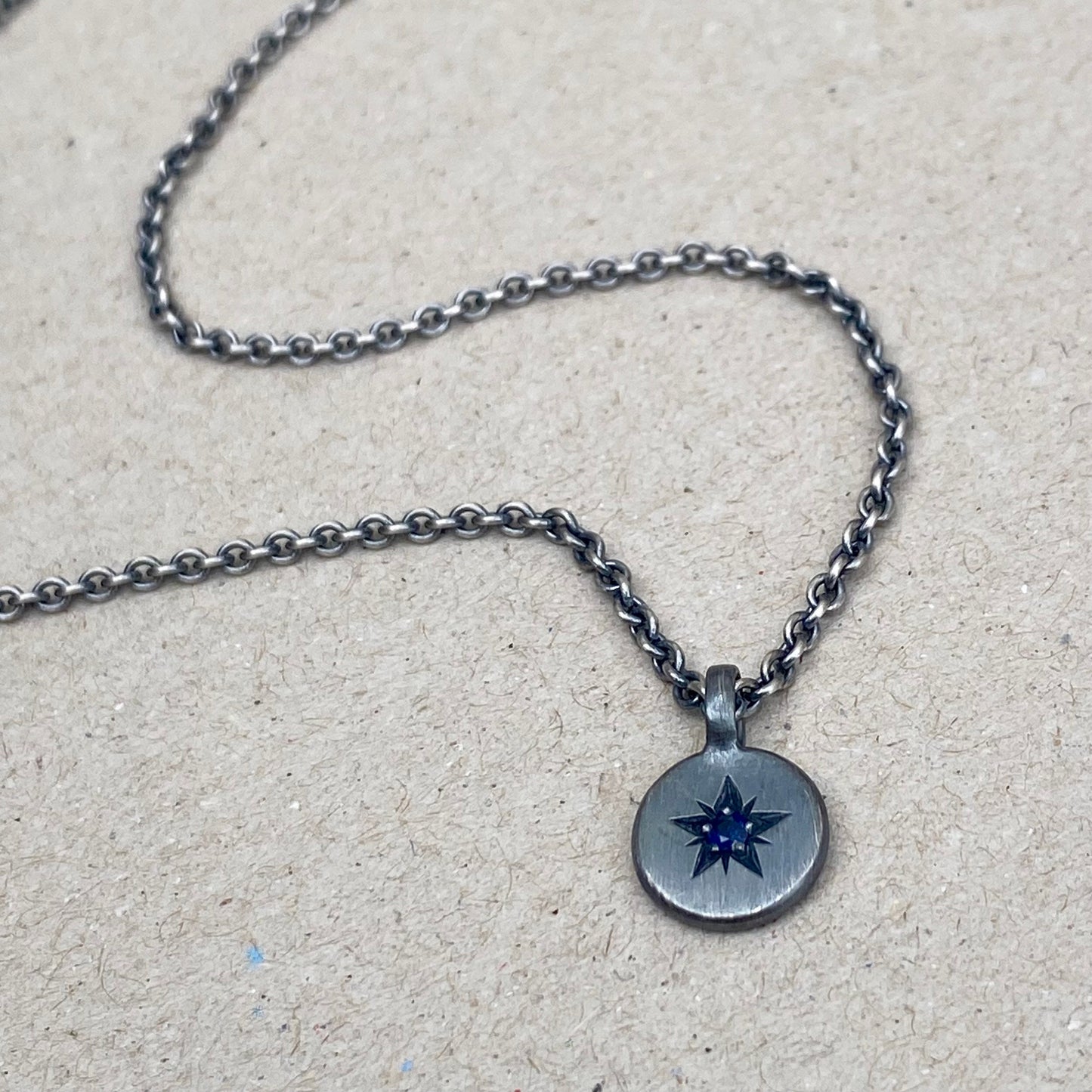 Oxidised silver star engraved birthstone 10mm pendant on a tight trace chain