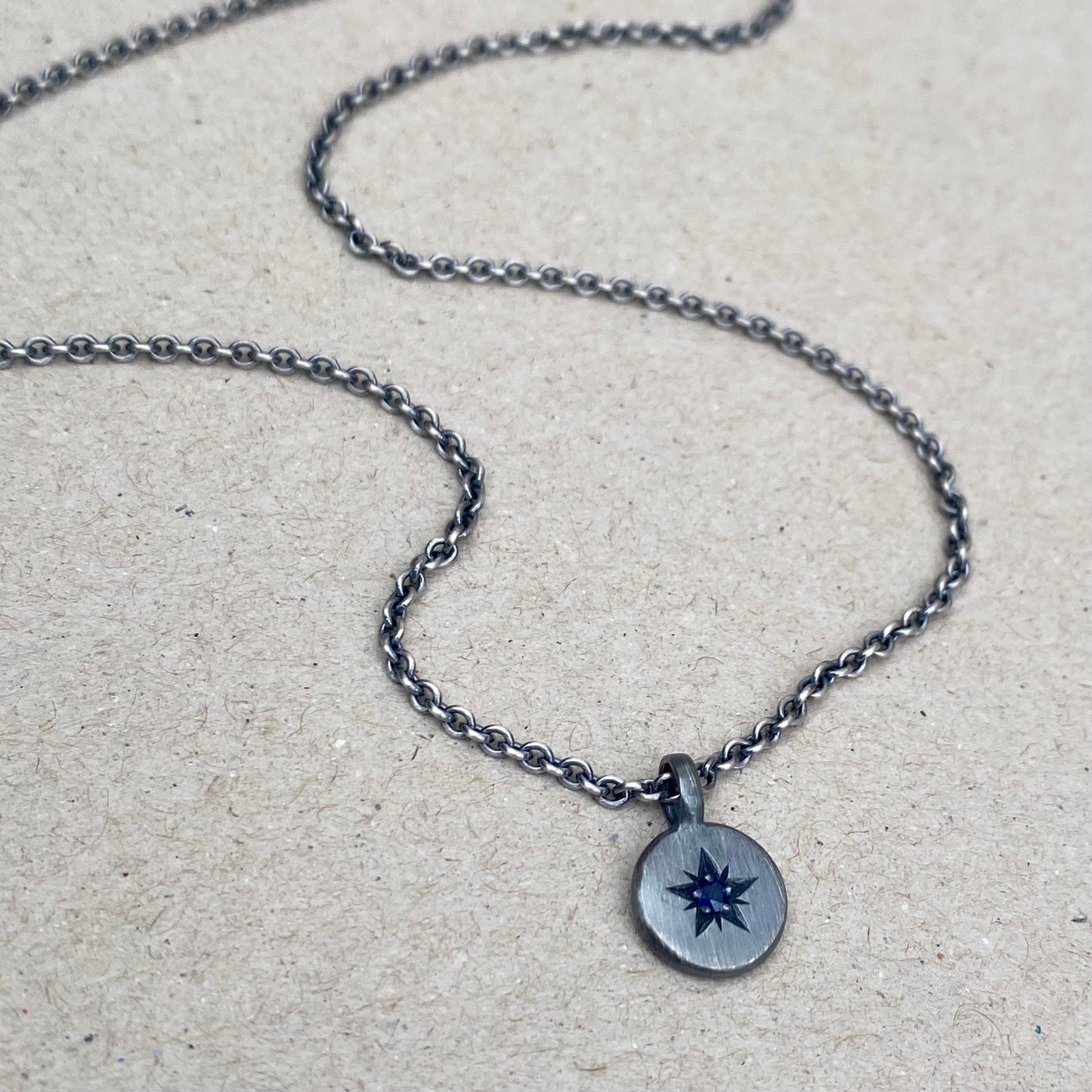 Oxidised silver star engraved birthstone 10mm pendant on a tight trace chain
