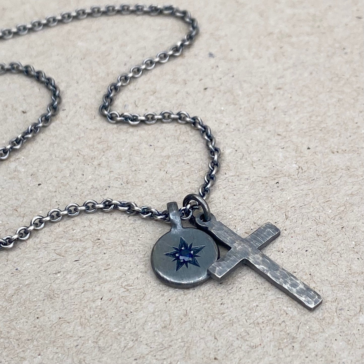 Oxidised silver star engraved birthstone 10mm pendant and hammered cross on tight trace chain