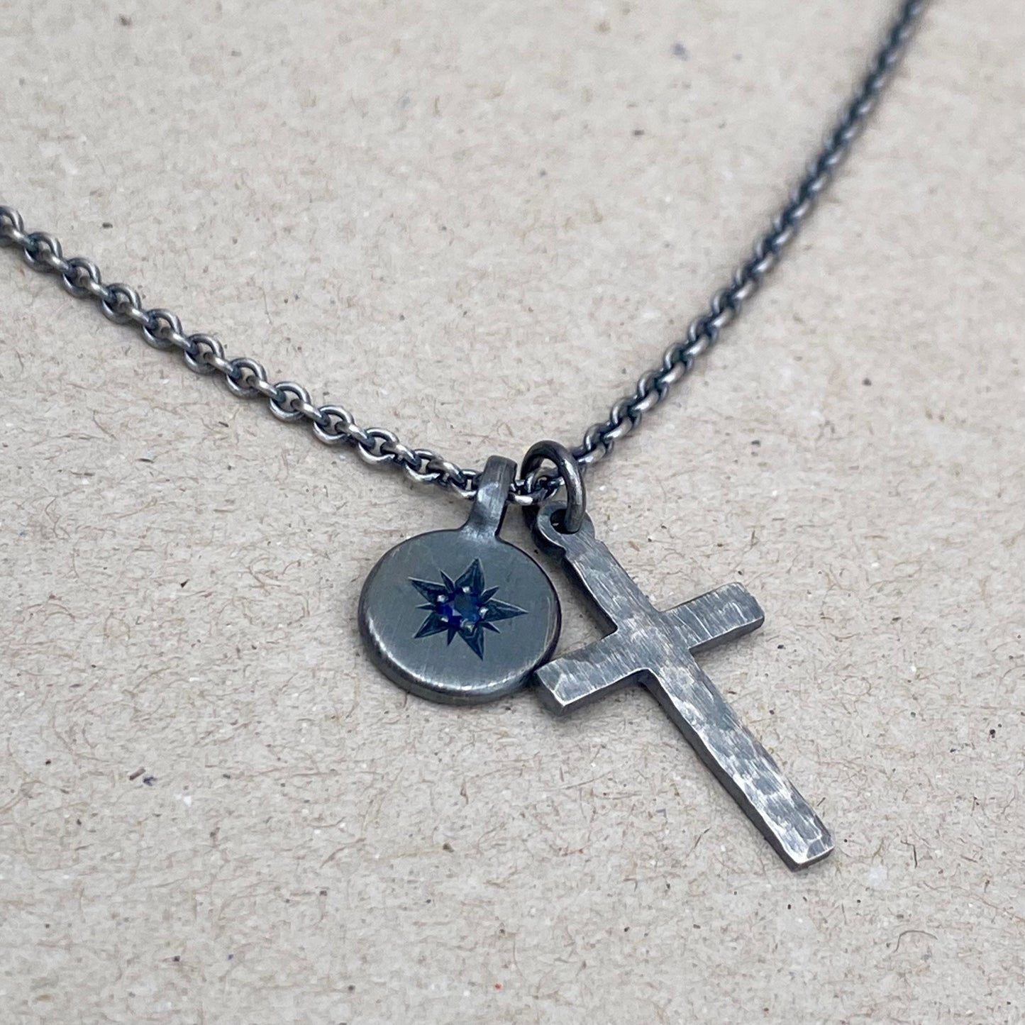 Oxidised silver star engraved birthstone 10mm pendant and hammered cross on tight trace chain