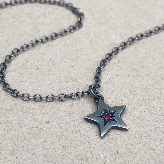 Oxidised silver star engraved birthstone star pendant on a trace chain