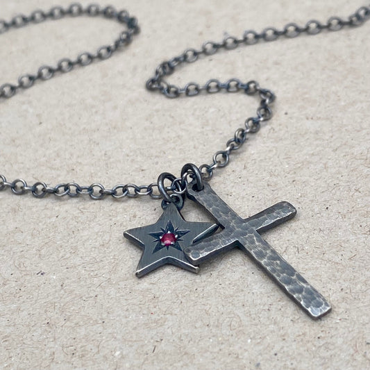 Oxidised silver star engraved birthstone star pendant and hammered cross on a trace chain