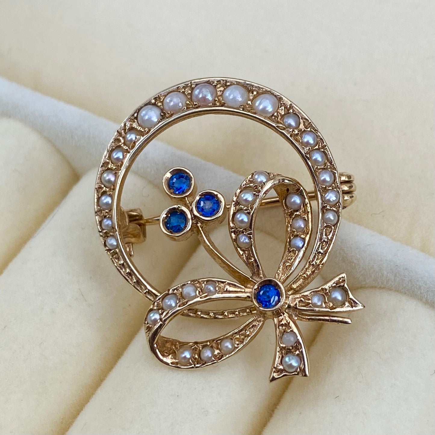 Vintage 9ct yellow gold seed pearl and blue sapphire flower, bow and crescent design brooch