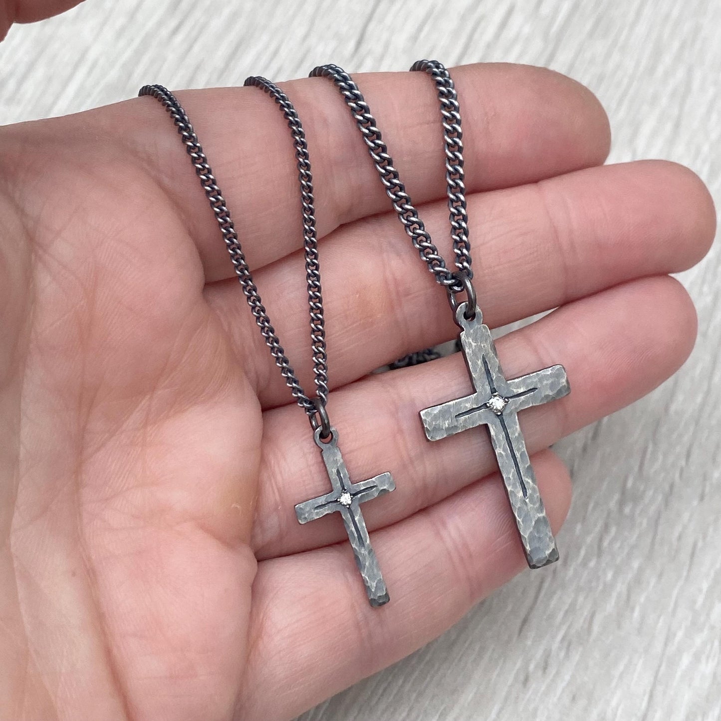 Oxidised solid sterling silver small or medium size diamond set cross pendants on a tight curb chain