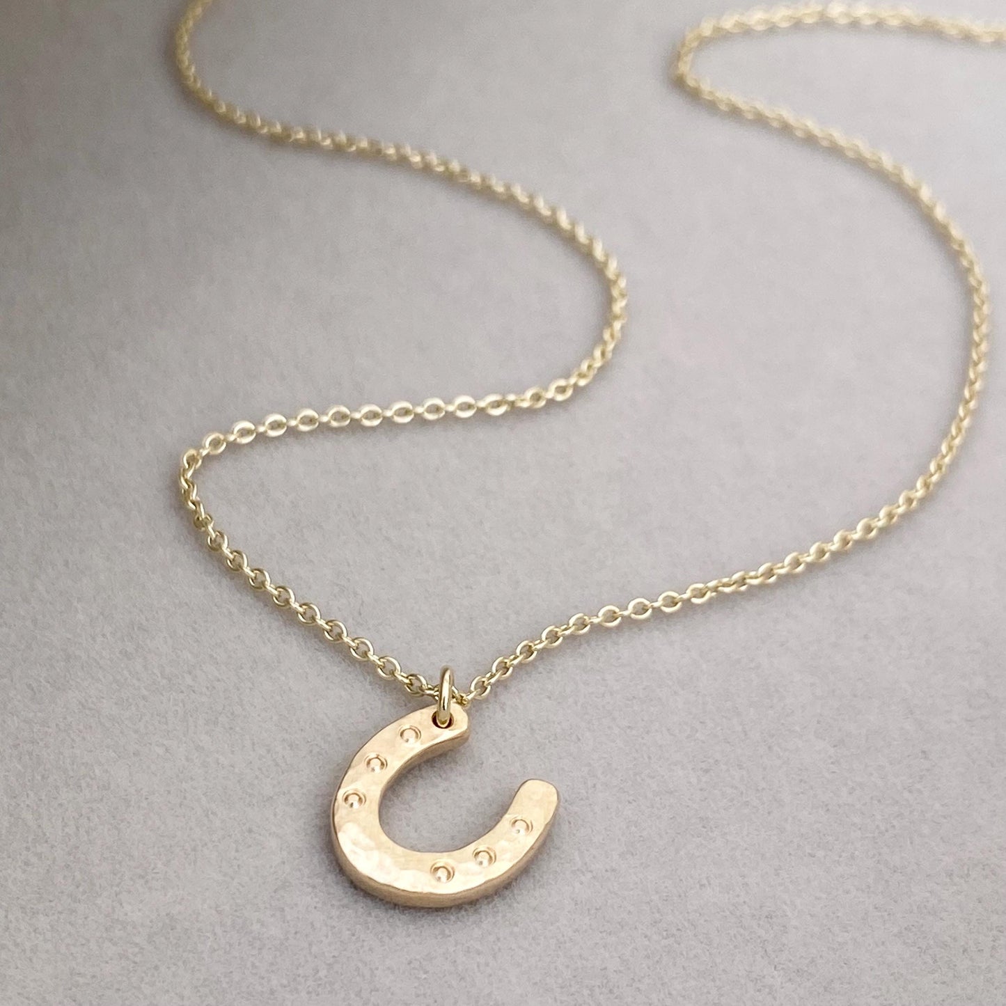 Handmade 9ct solid yellow, rose or white gold lucky horse shoe charm pendant on a trace chain