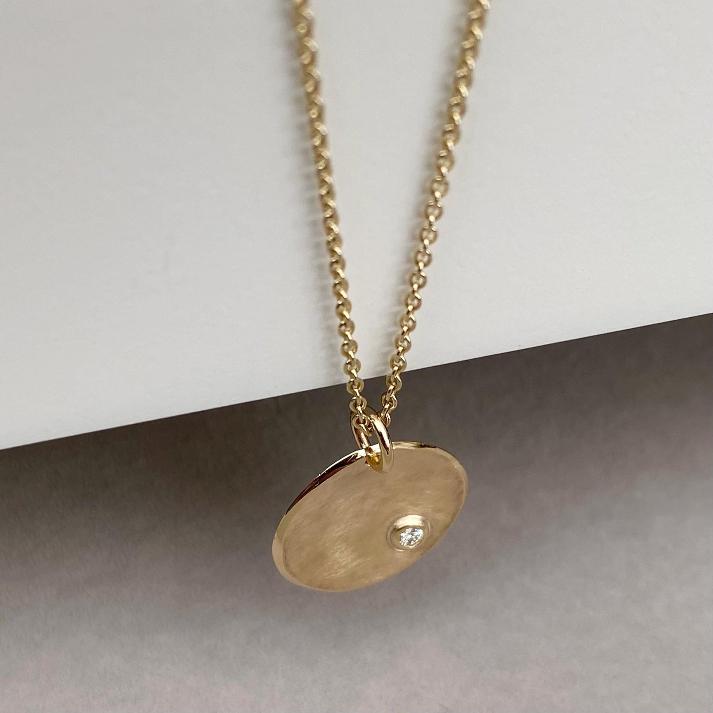 Handmade 9ct yellow, rose or white gold 16mm petal pendant with a 2mm natural diamond on a trace chain