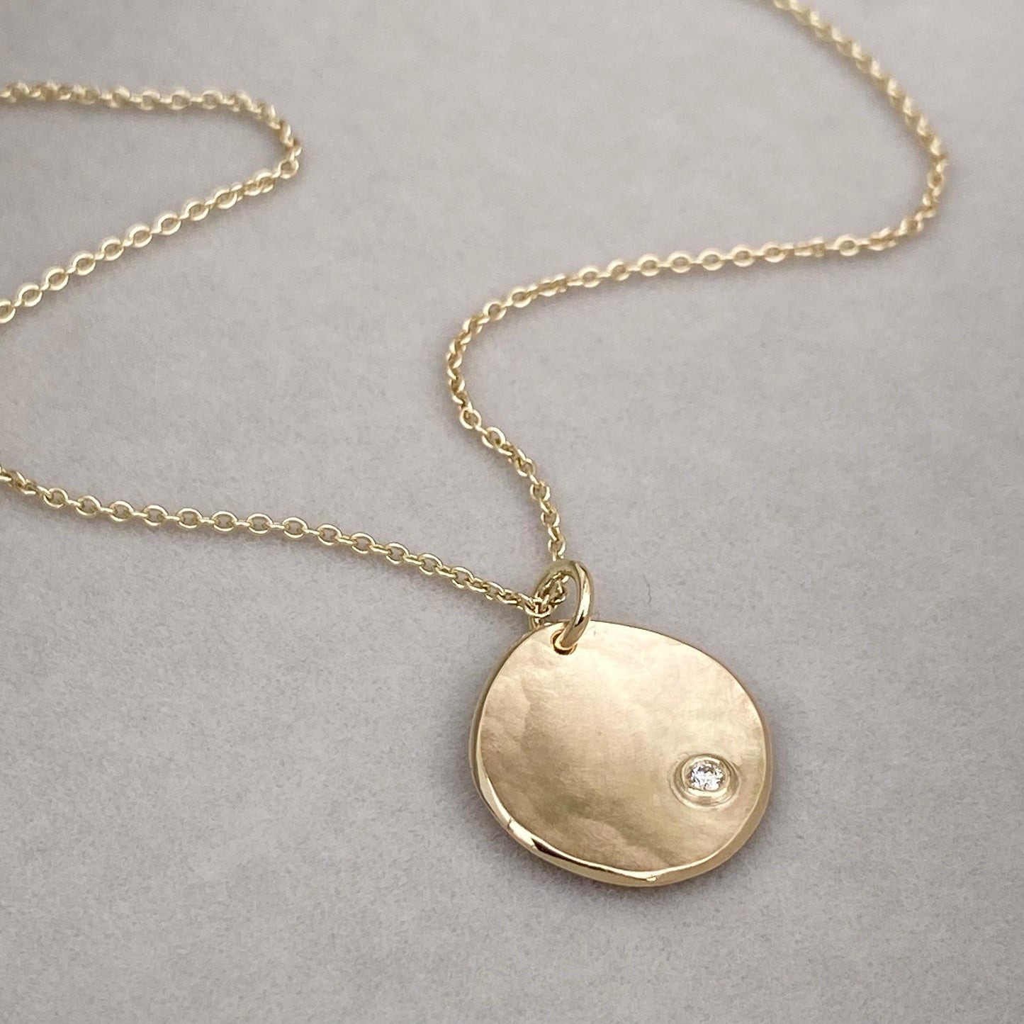 Handmade 9ct yellow, rose or white gold 16mm petal pendant with a 2mm natural diamond on a trace chain