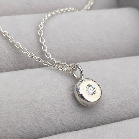 Handmade 2mm round natural diamond silver nugget pendant on a trace chain