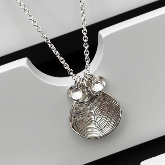 Handmade solid silver 16mm fingerprint petal charm pendant and 6 tiny petals on a trace chain