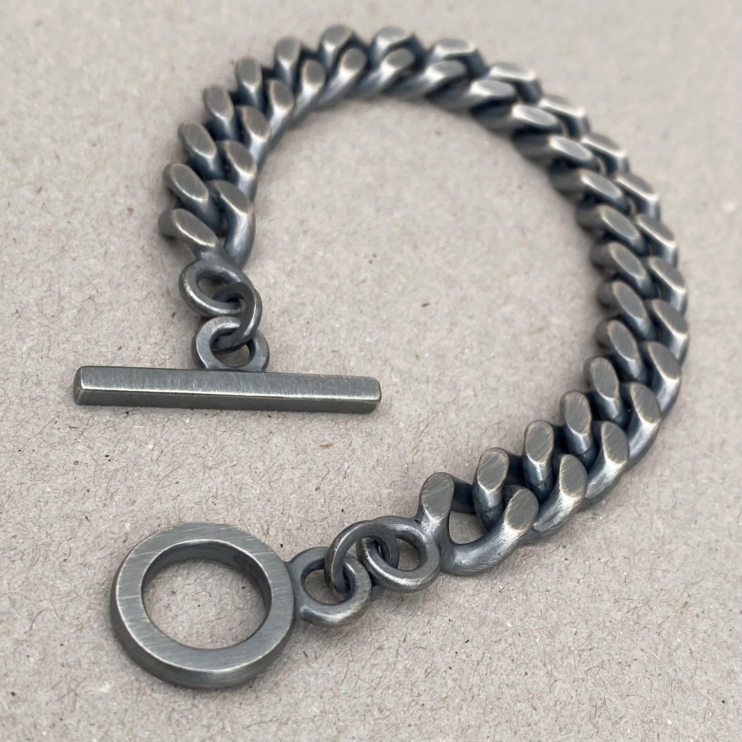 Oxidised solid silver 10.4mm wide heavy filed curb chain bracelet with a handmade T-bar
