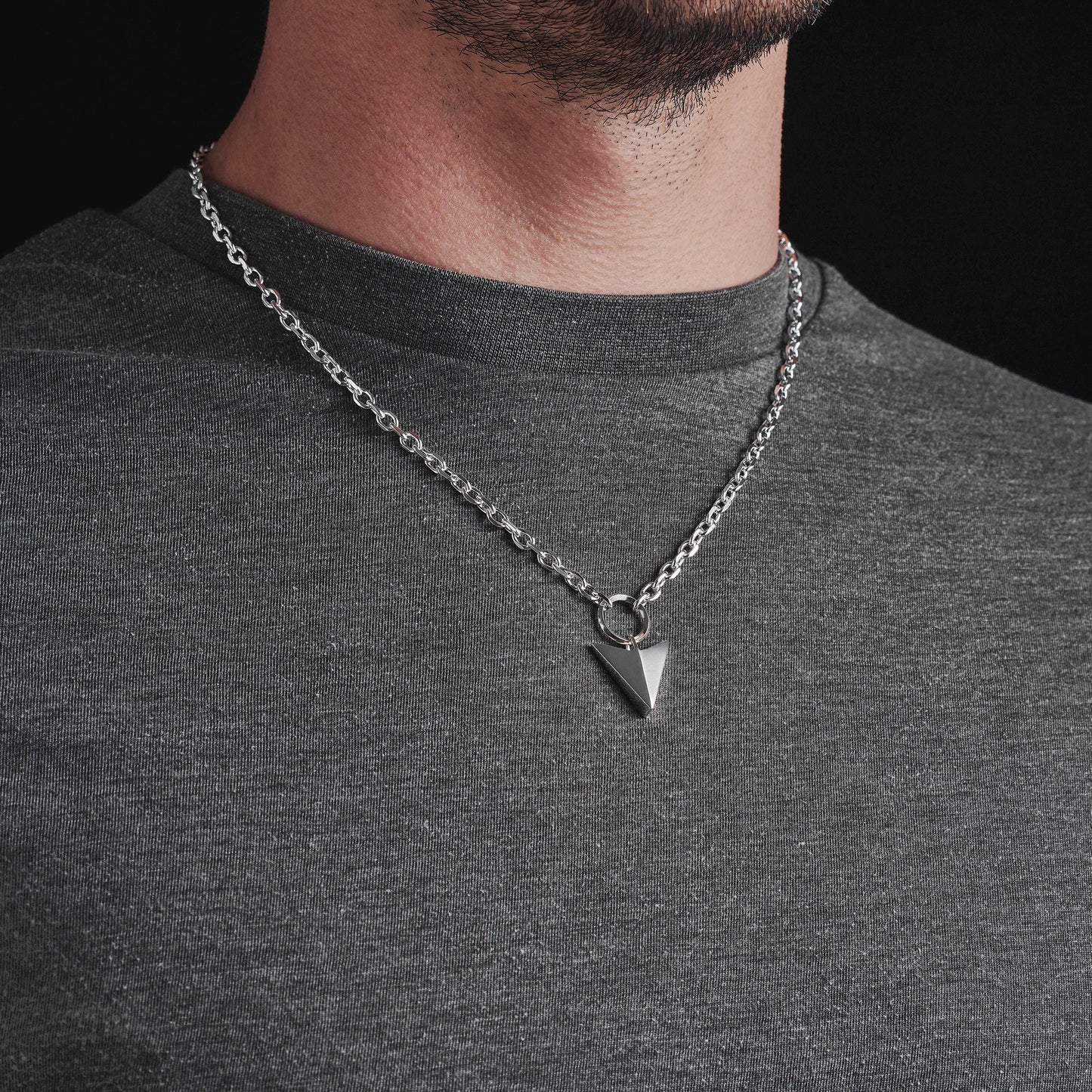 Oxidised or polished solid sterling silver large arrow and loop detail pendant on a diamond cut trace chain