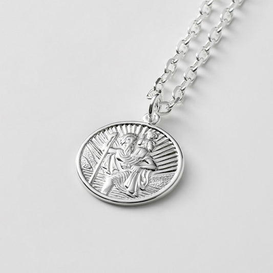 Oxidised or polished solid silver round Saint Christopher pendant on a diamond cut trace chain