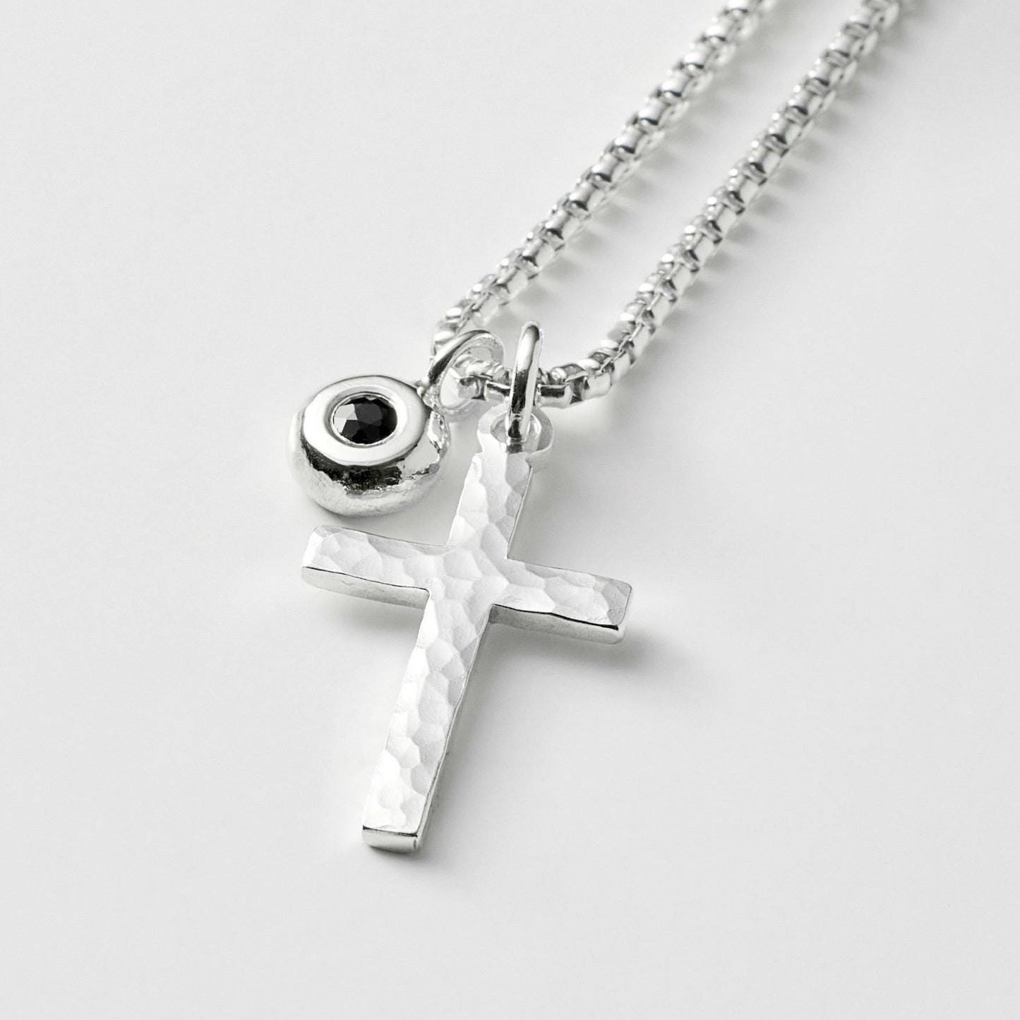 Oxidised or polished small size solid silver hammered cross pendant and black sapphire nugget charm and box chain