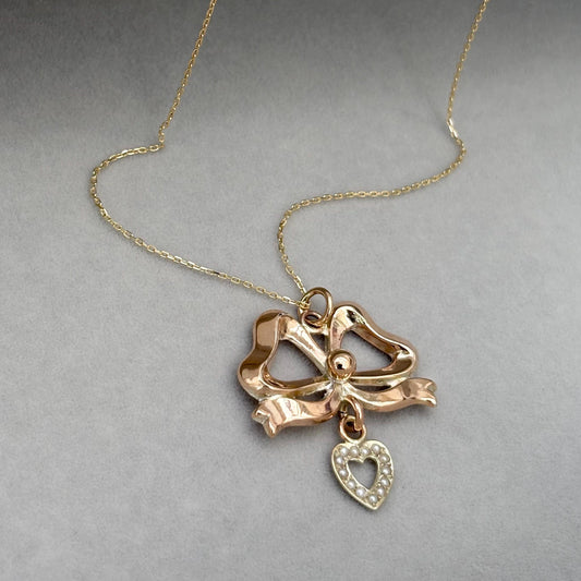 Vintage 9ct rose gold ribbon bow and seed pearl heart pendant on a new fine 0.8mm 9ct yellow gold chain