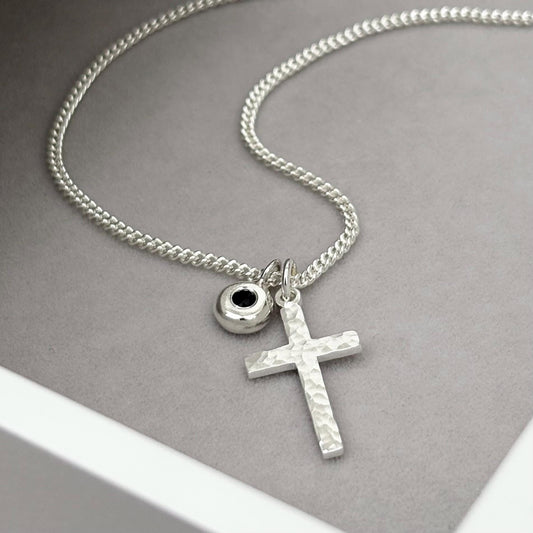 Oxidised or polished small size solid silver hammered cross pendant and black sapphire nugget charm on a curb chain