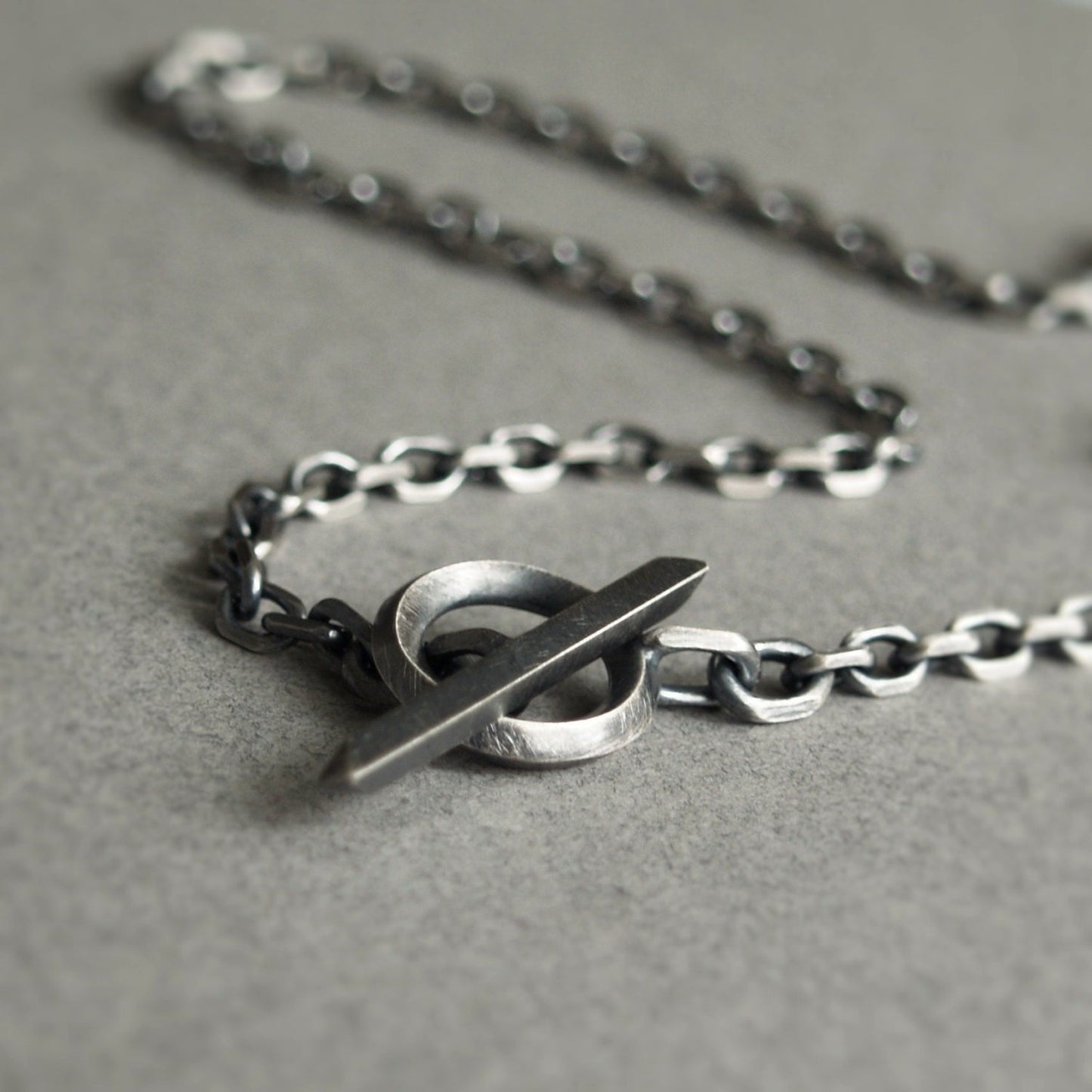 Oxidised or polished solid silver 4.2mm wide diamond cut trace chain with a unique T-bar design