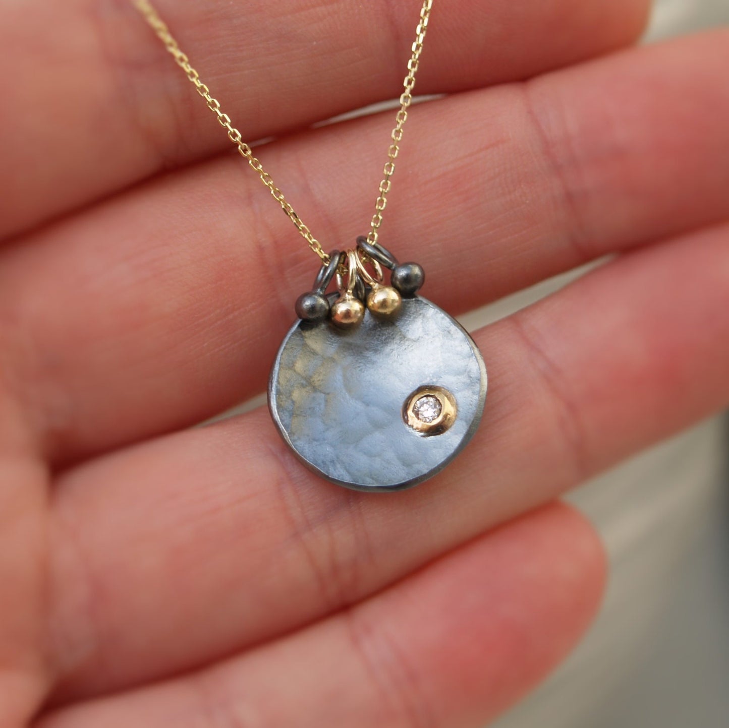 Oxidised silver and 9ct gold diamond petal pendant on a fine 9ct yellow gold chain with seed detail