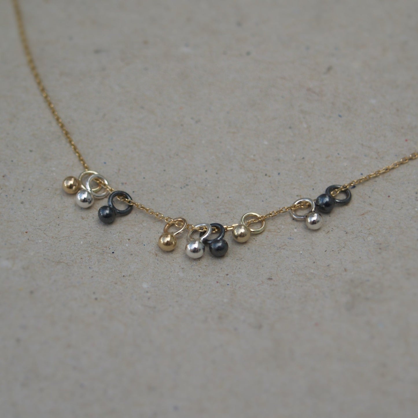 9ct solid yellow gold, silver and oxidised silver tiny seed ball pendants on a 9ct yellow gold chain