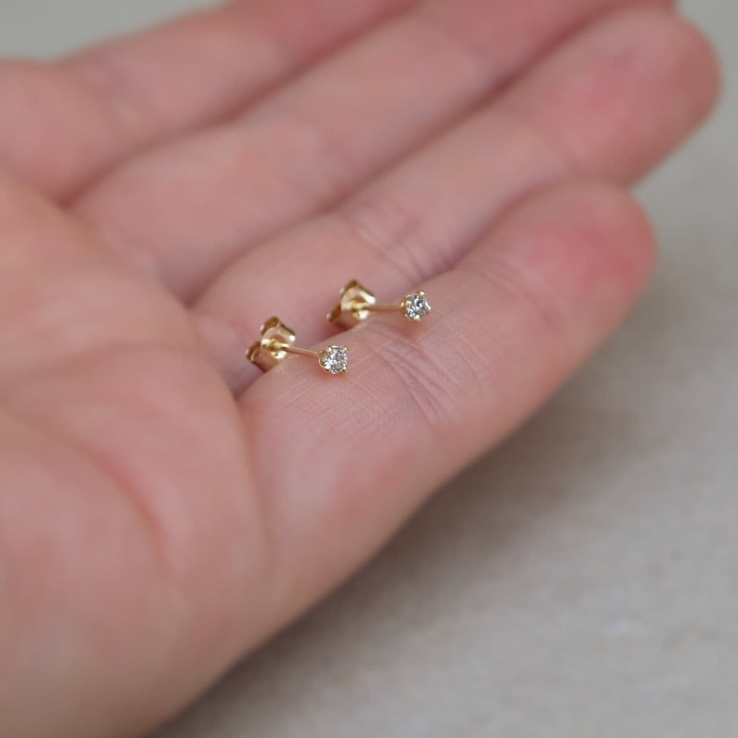 9ct yellow gold tiny 2.mm natrual diamond claw set stud earrings