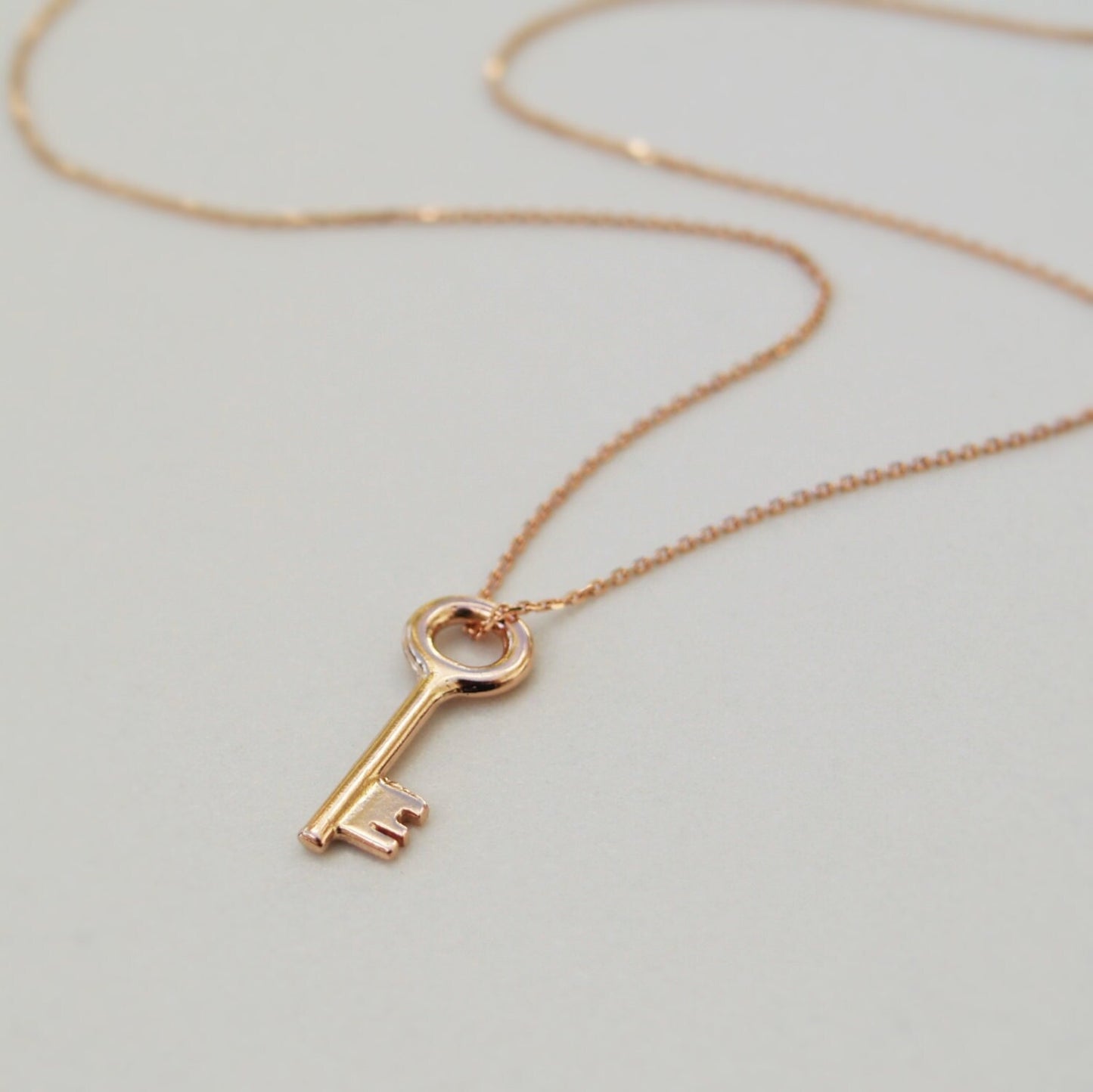 9ct solid rose gold small and dainty key charm pendant and chain
