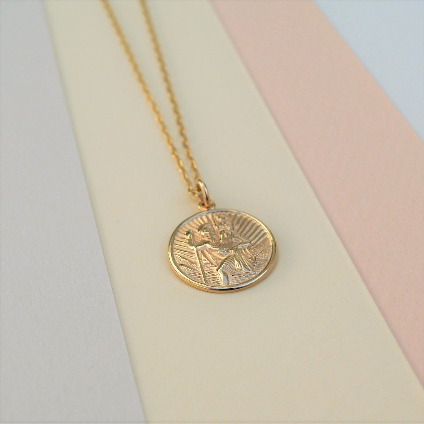 9ct solid yellow gold Saint Christopher pendant on a 1.1mm wide diamond cut trace chain